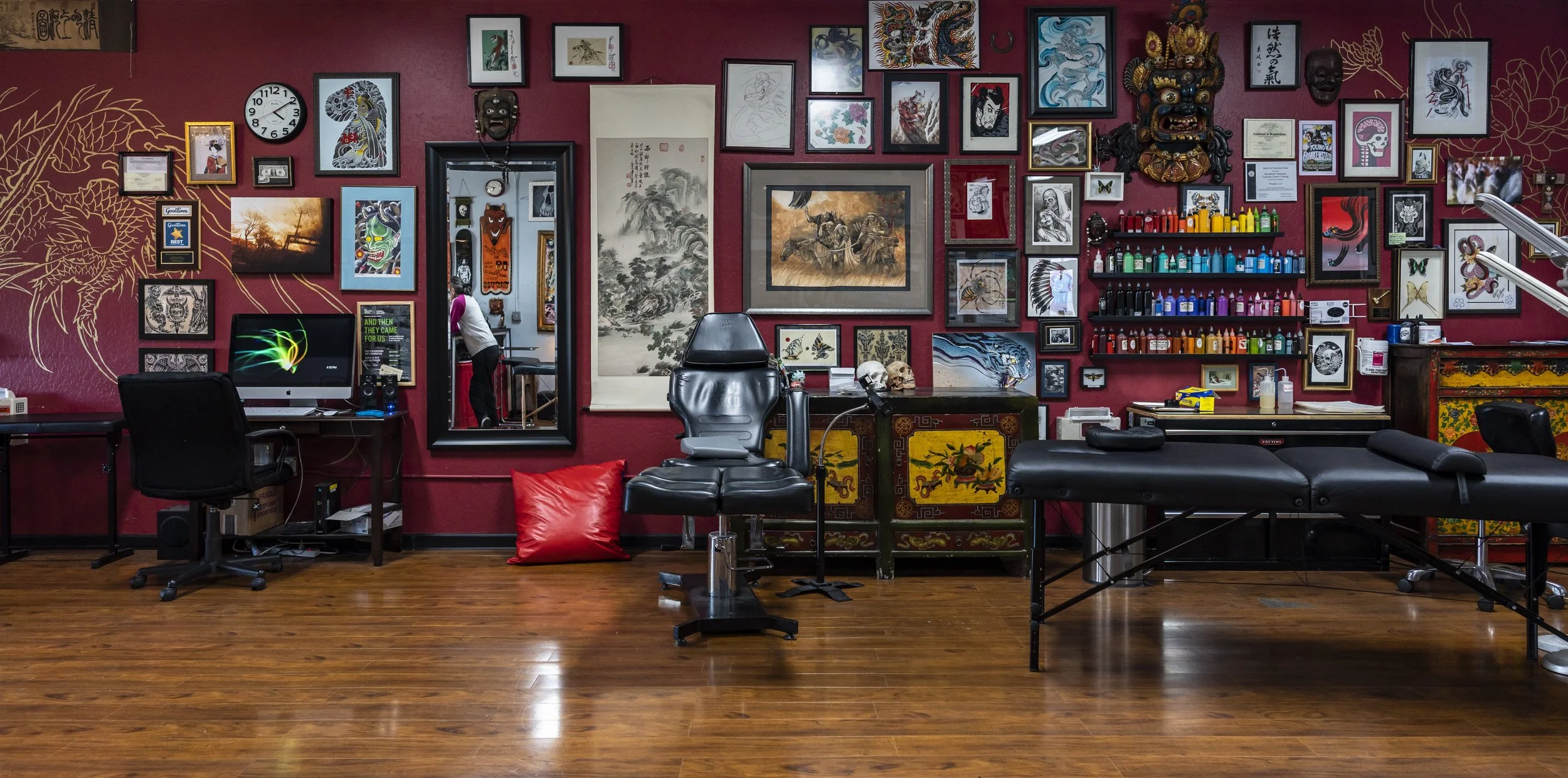Tattoo studio artist creating a custom illustrative design