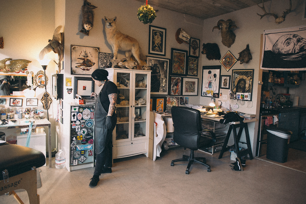 Illustrative tattoo artwork displayed in a studio setting