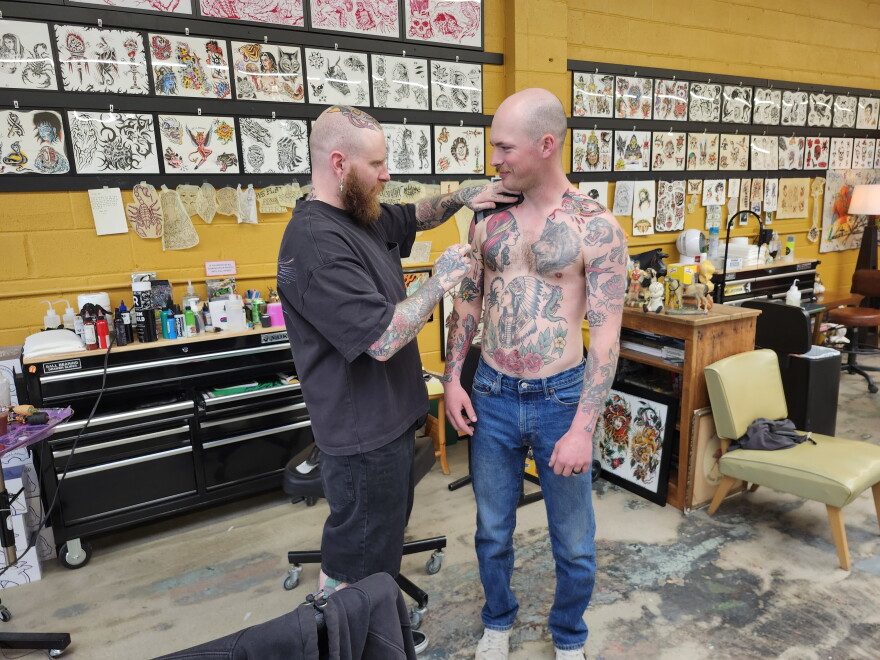 Fine line tattoo artwork being prepared by an artist
