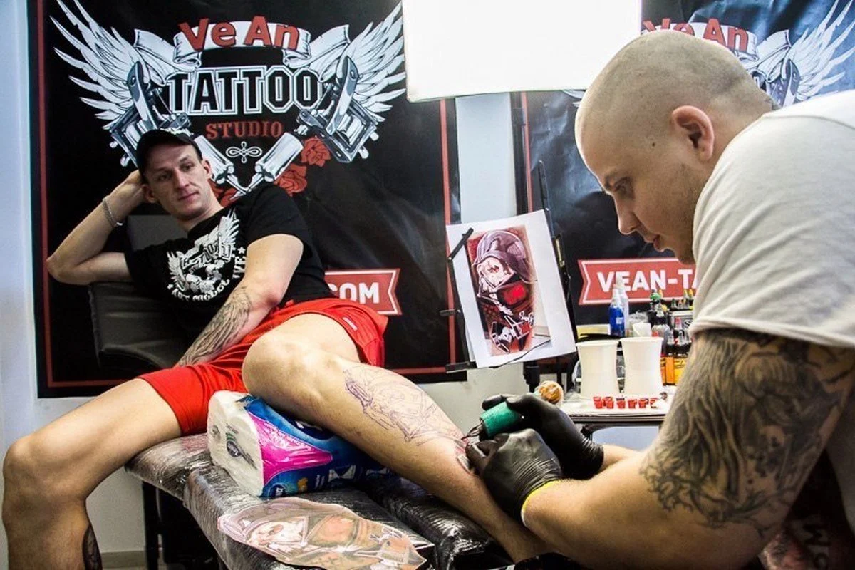 Fine line tattoo artwork displayed in a studio