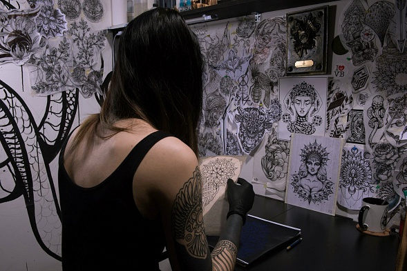 Bold blackwork tattoo design with graphic details